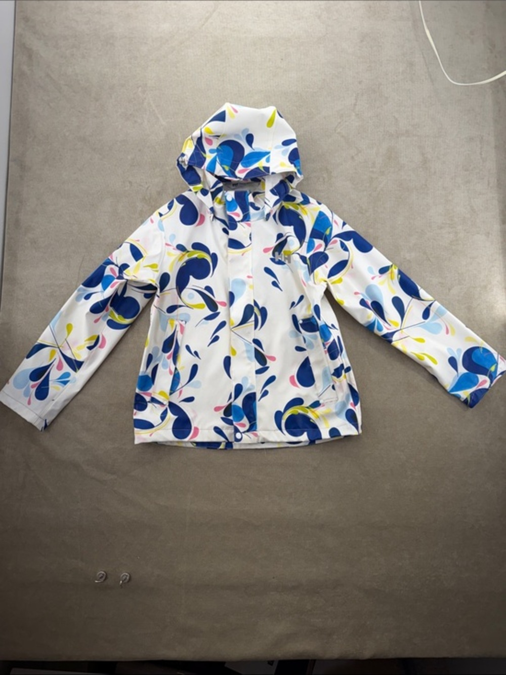 Helly Hansen White Kids Raincoat with Blue, Yellow & Pink Splash Pattern